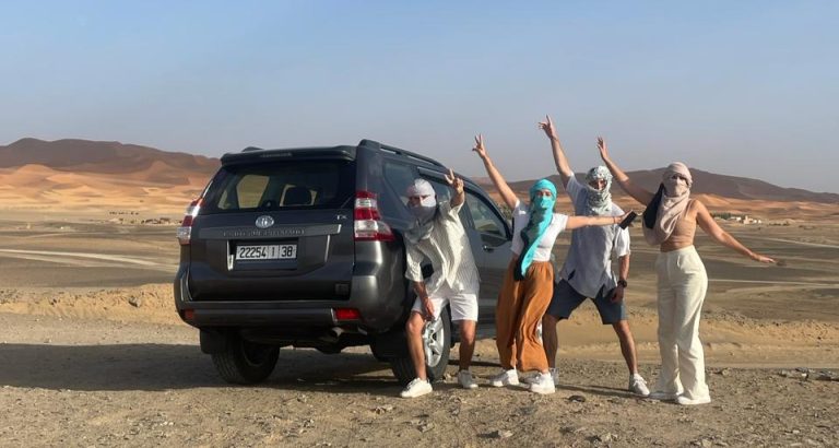 Family in 4x4 in the desert