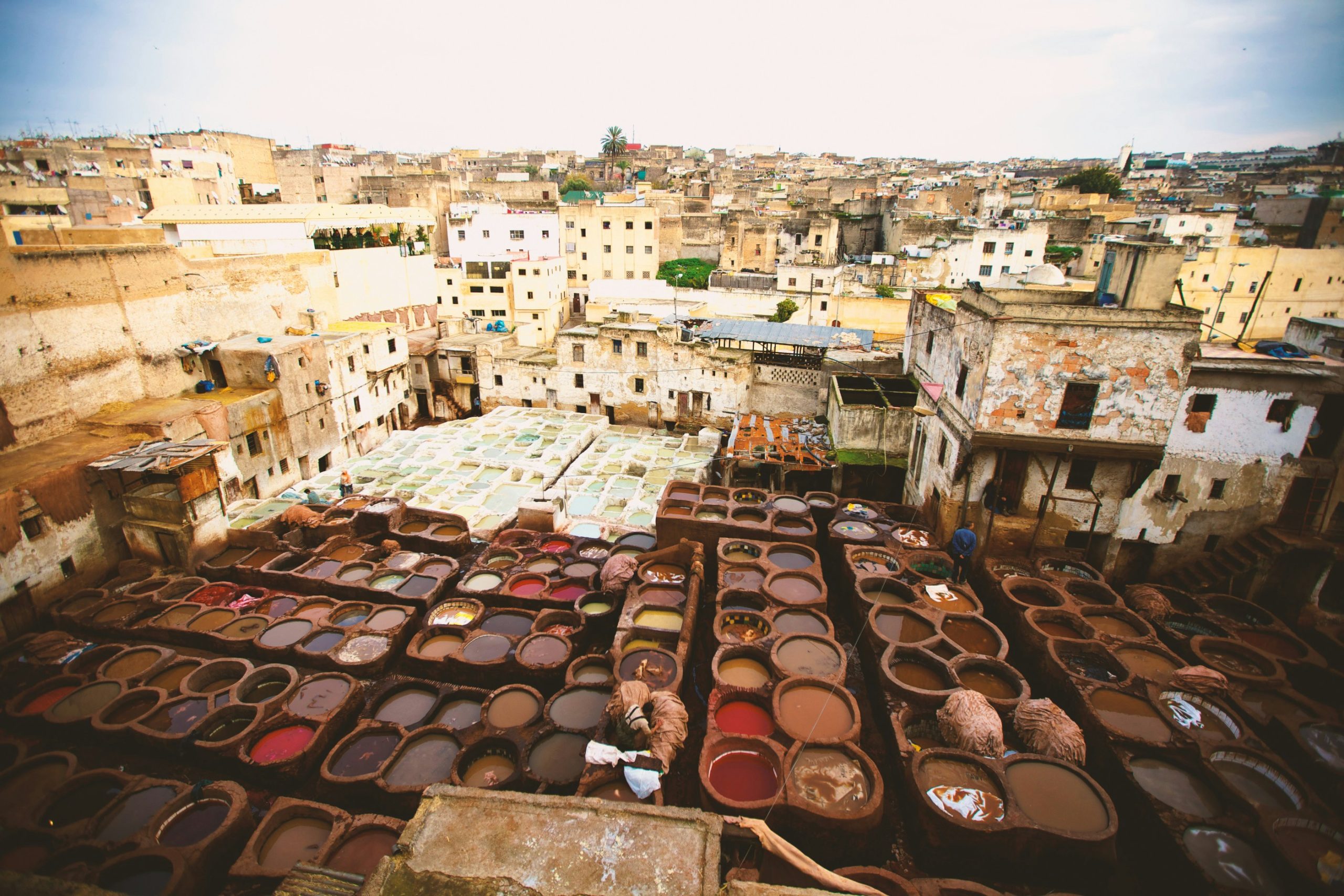 Ancient alleyways of Fez medina with artisans